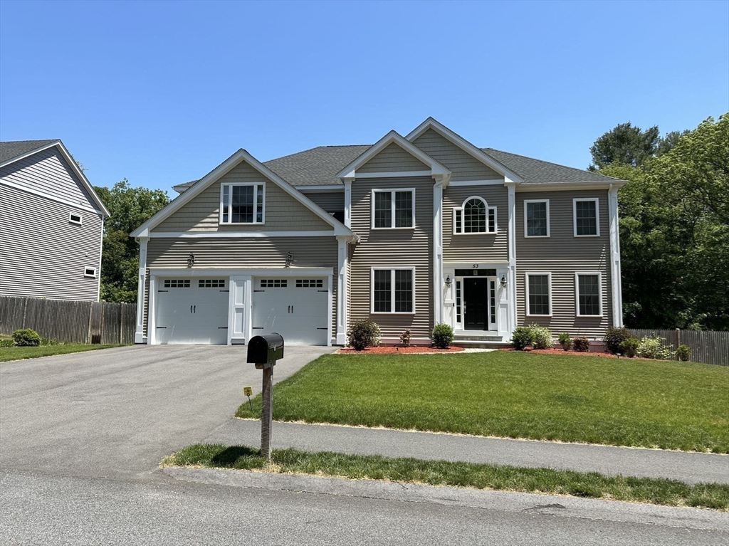 53 Wellesley Rd Extension Natick, MA 01760 - Photo 27 of 27 a front view of a house with a yard