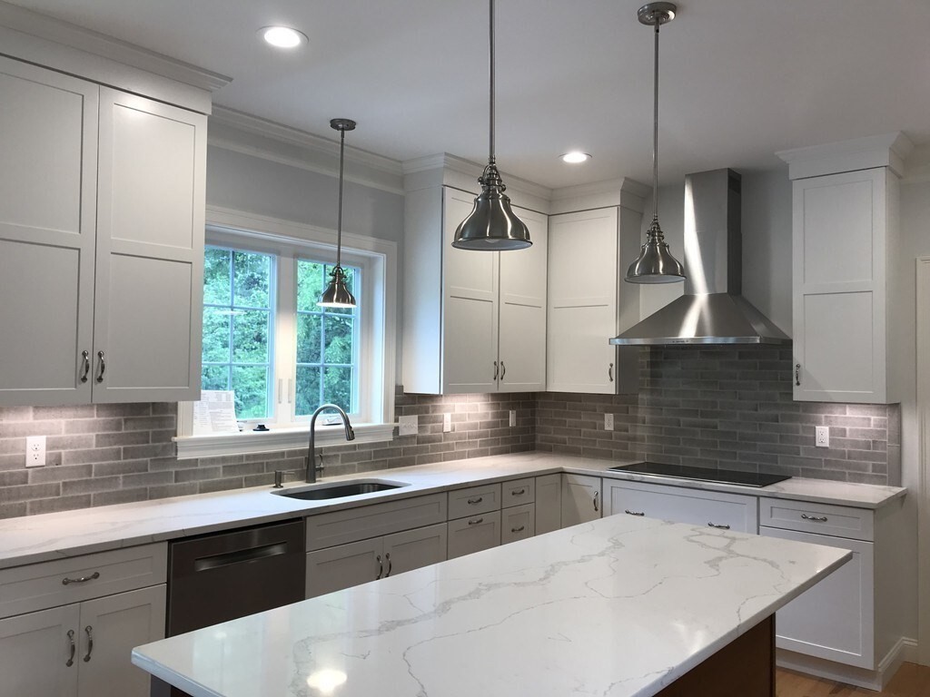 53 Wellesley Rd Extension Natick, MA 01760 - Photo 3 of 27 a kitchen with a sink a counter top space cabinets and stainless steel appliances