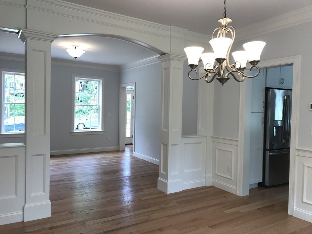 53 Wellesley Rd Extension Natick, MA 01760 - Photo 8 of 27 a view of an entryway with wooden floors
