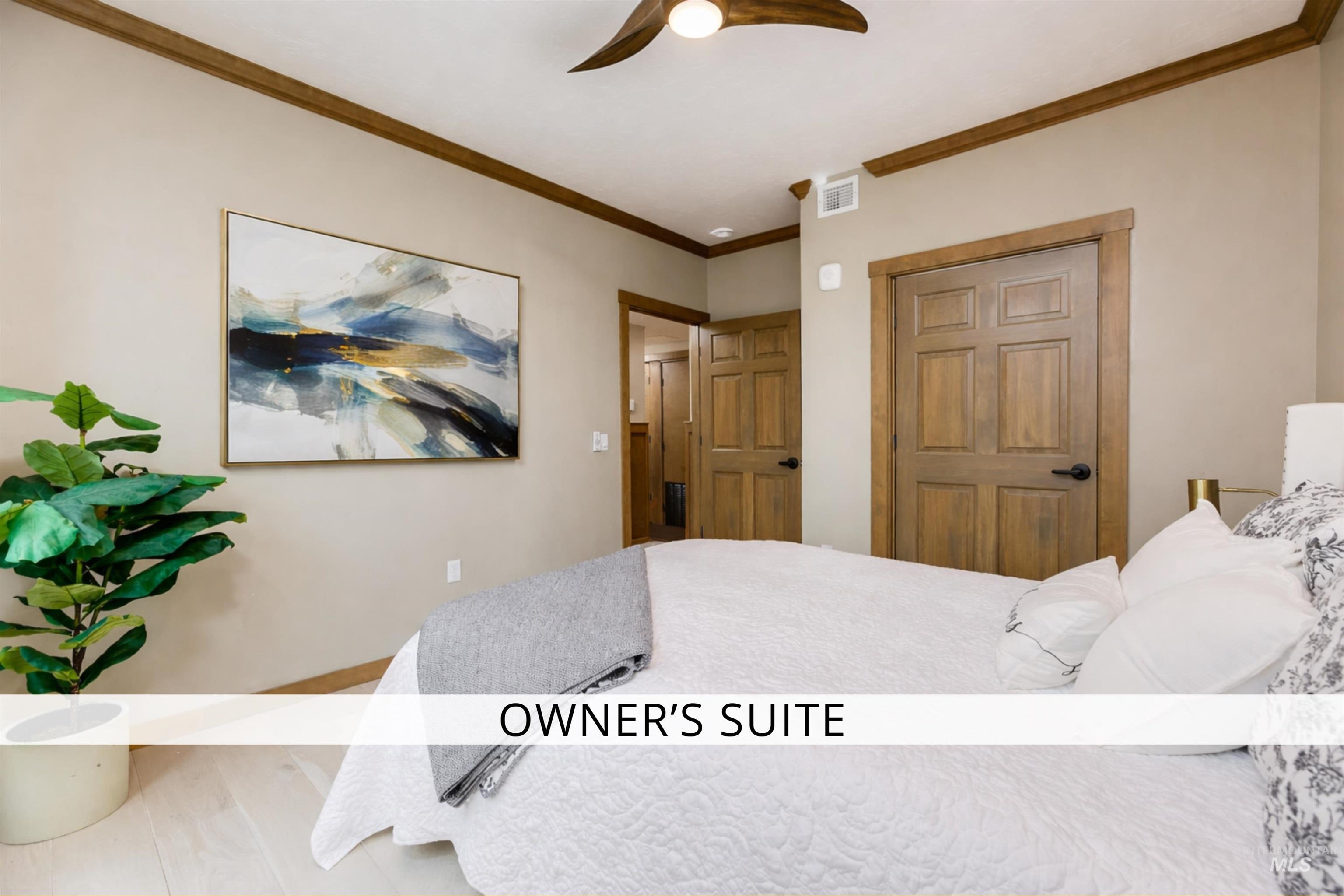 79 West Aikens Road, Unit 203 Eagle, ID 83616 - Photo 18 of 41 Bedroom featuring crown molding and ceiling fan