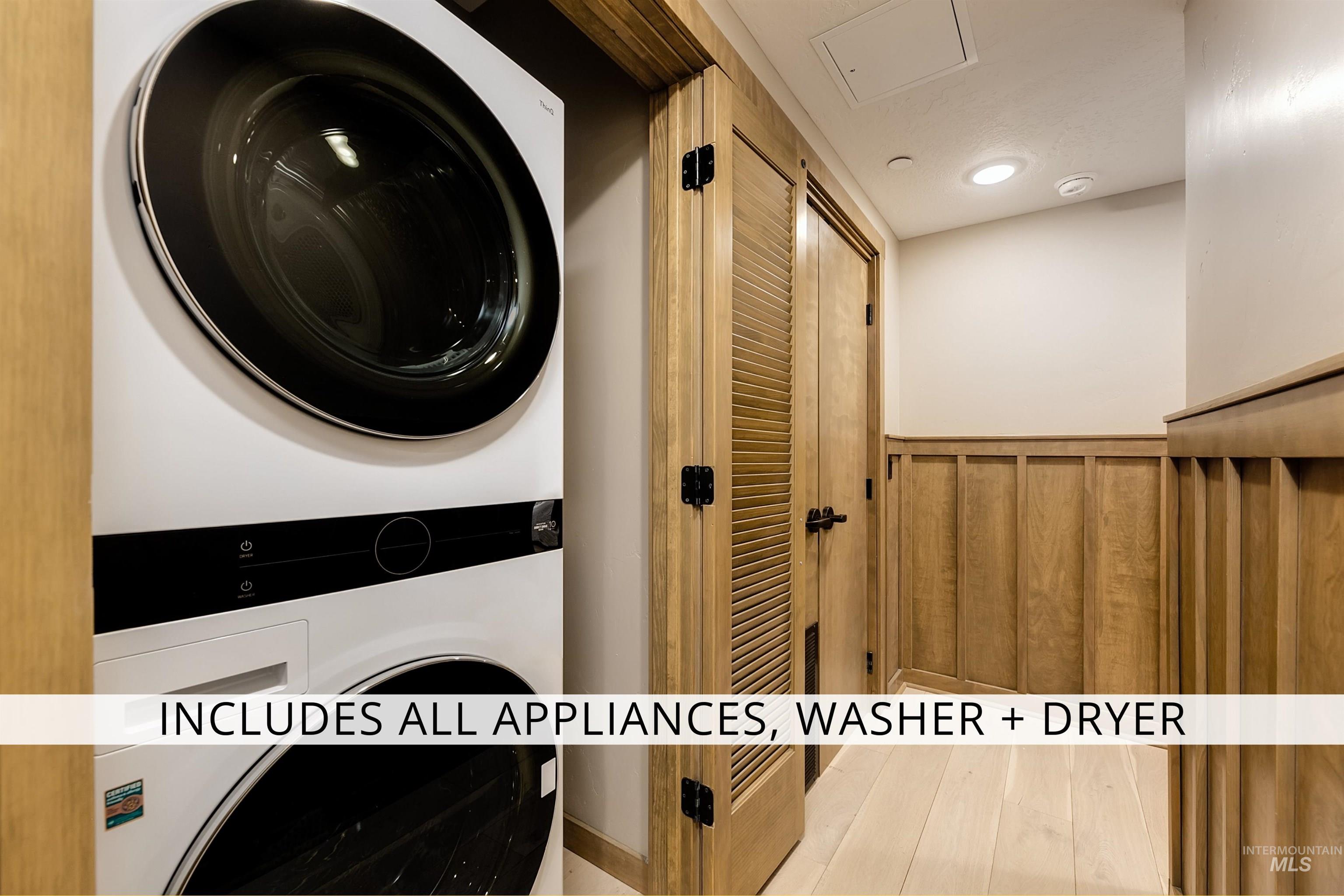 79 West Aikens Road, Unit 203 Eagle, ID 83616 - Photo 25 of 41 Laundry area featuring stacked washer / dryer, wainscoting, and recessed lighting