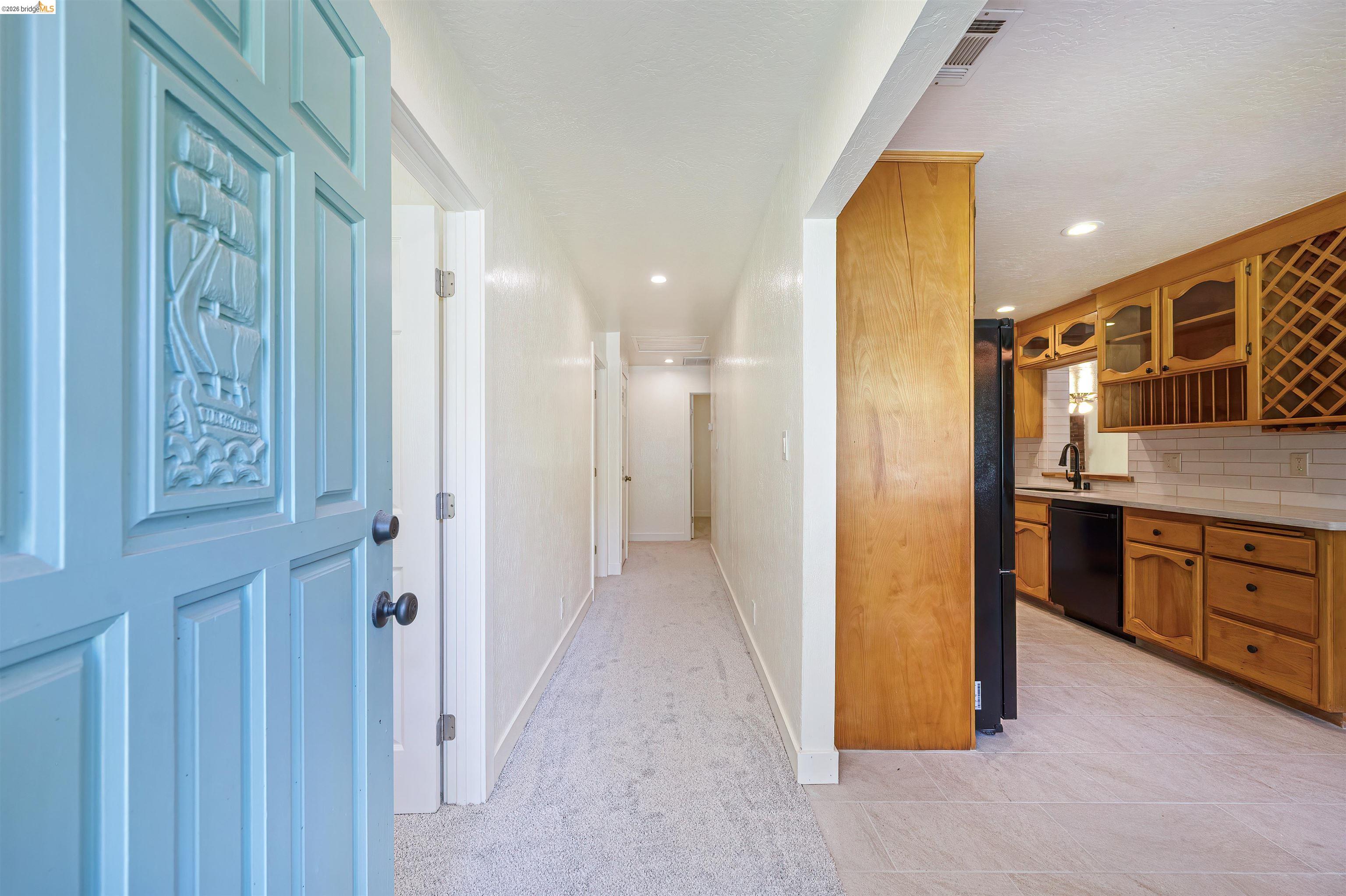 10474 Sheldon Road Elk Grove, CA 95624 - Photo 26 of 83 Light blue entry door with carved ship detail