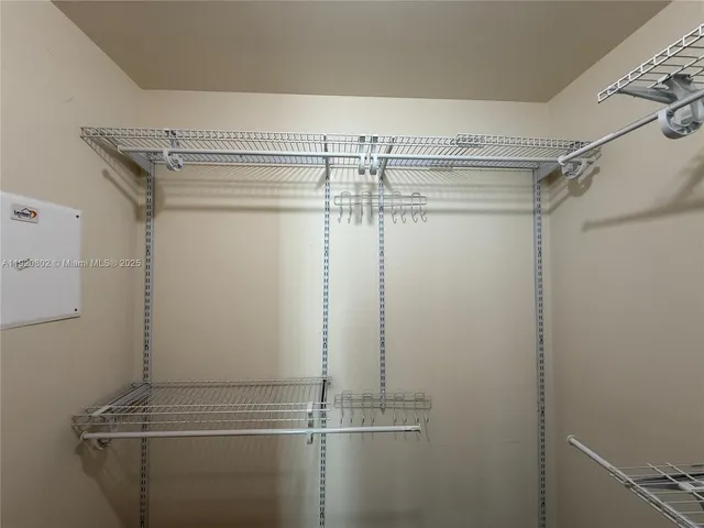 a bathroom with a glass door shower