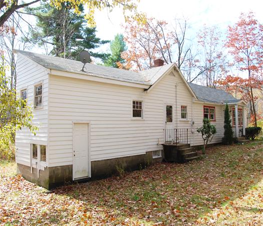 110 Whitney Road Ashby, MA 01431 - Photo 13 of 15 a view of a white house with a yard and large tree