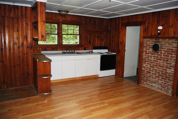 110 Whitney Road Ashby, MA 01431 - Photo 6 of 15 a kitchen with a refrigerator and a sink