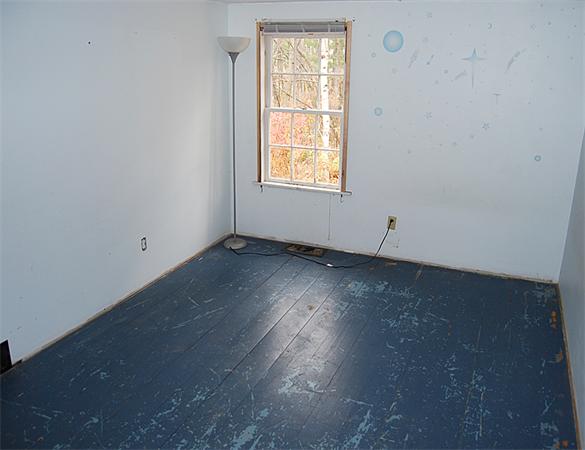 110 Whitney Road Ashby, MA 01431 - Photo 10 of 15 an empty room with wooden floor and windows