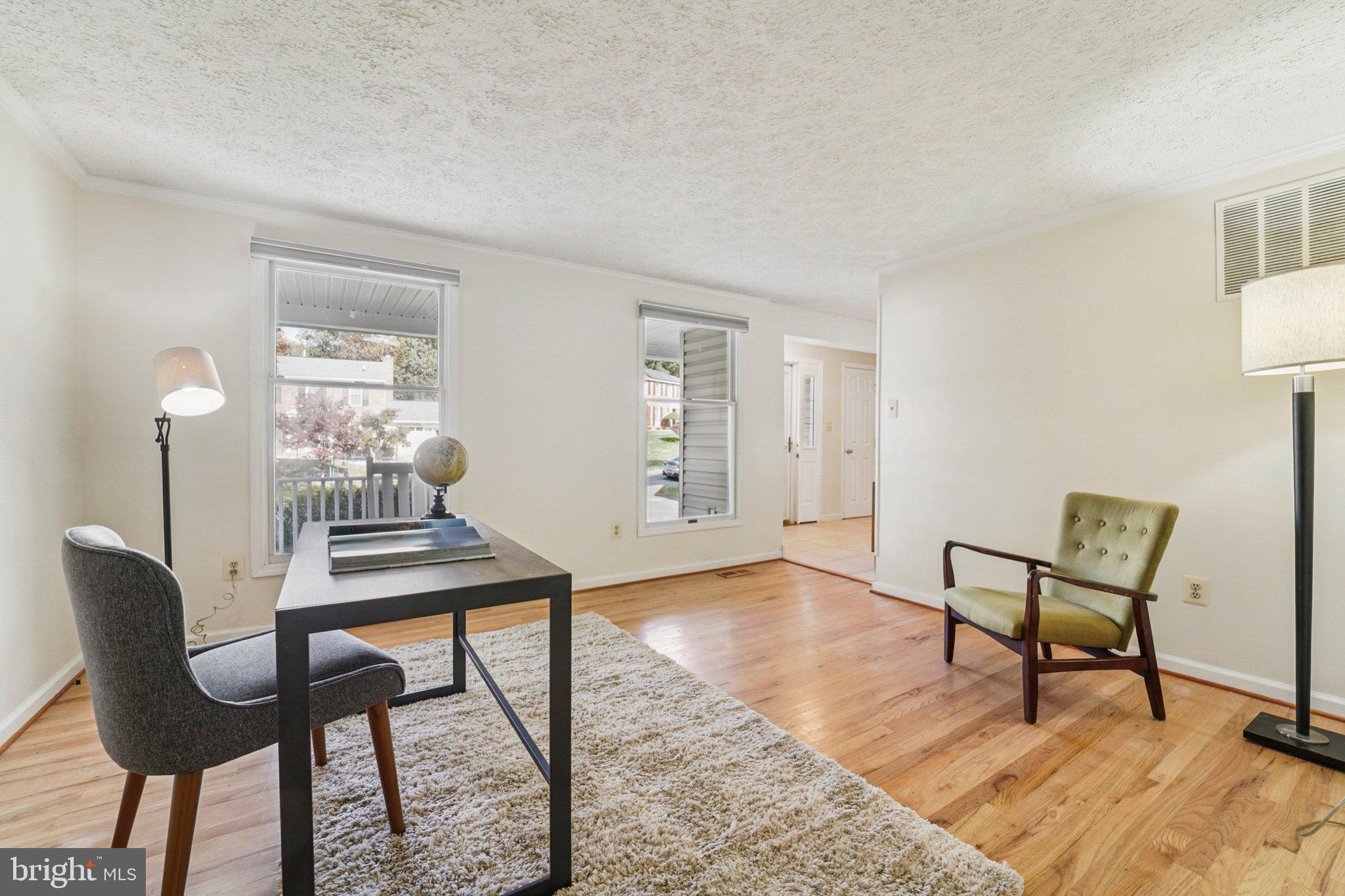 14820 Windmill Terrace Silver Spring, MD 20905 - Photo 16 of 33 a view of a livingroom with furniture and wooden floor