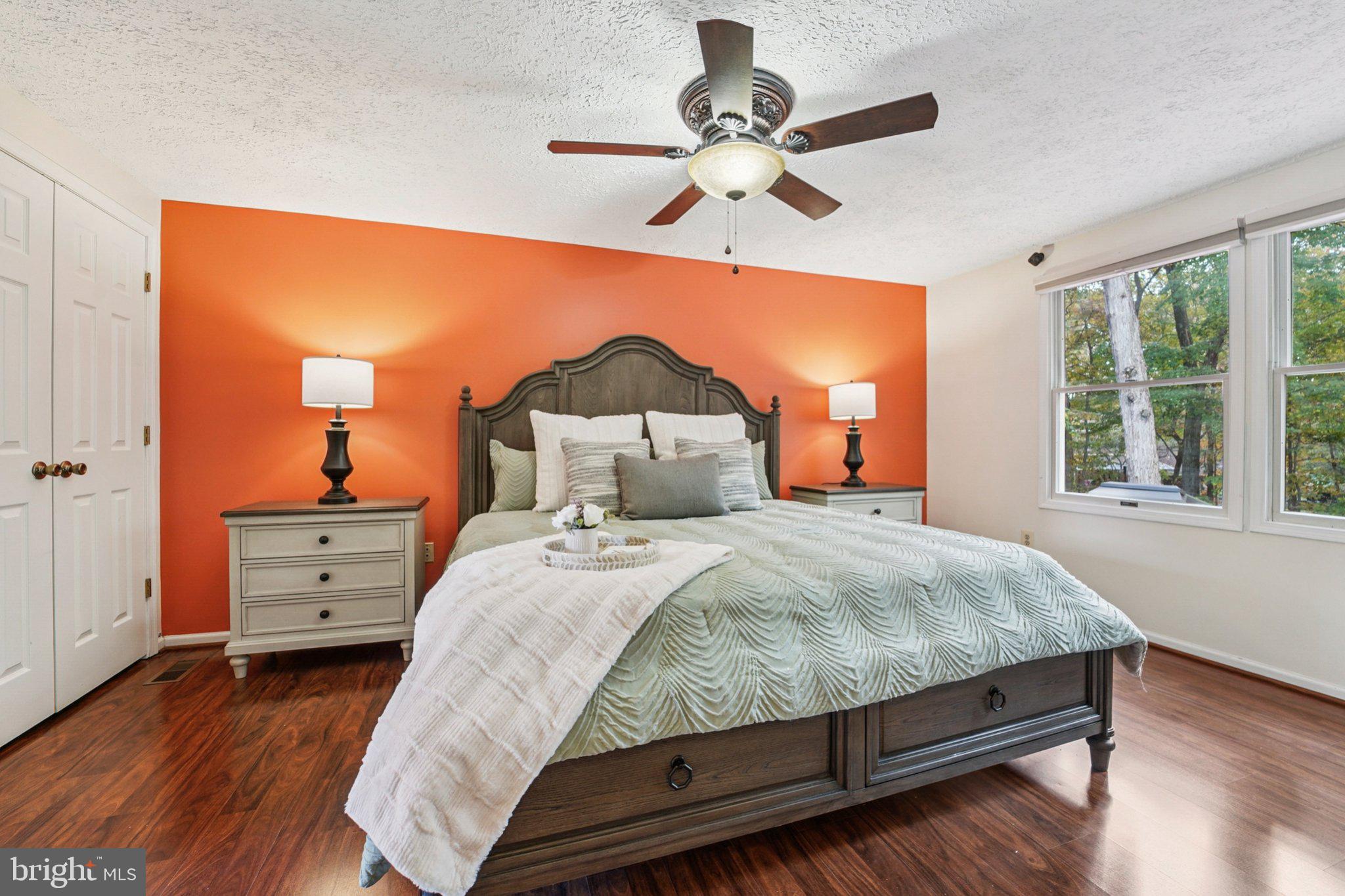 14820 Windmill Terrace Silver Spring, MD 20905 - Photo 17 of 33 a bedroom with a bed and a chandelier