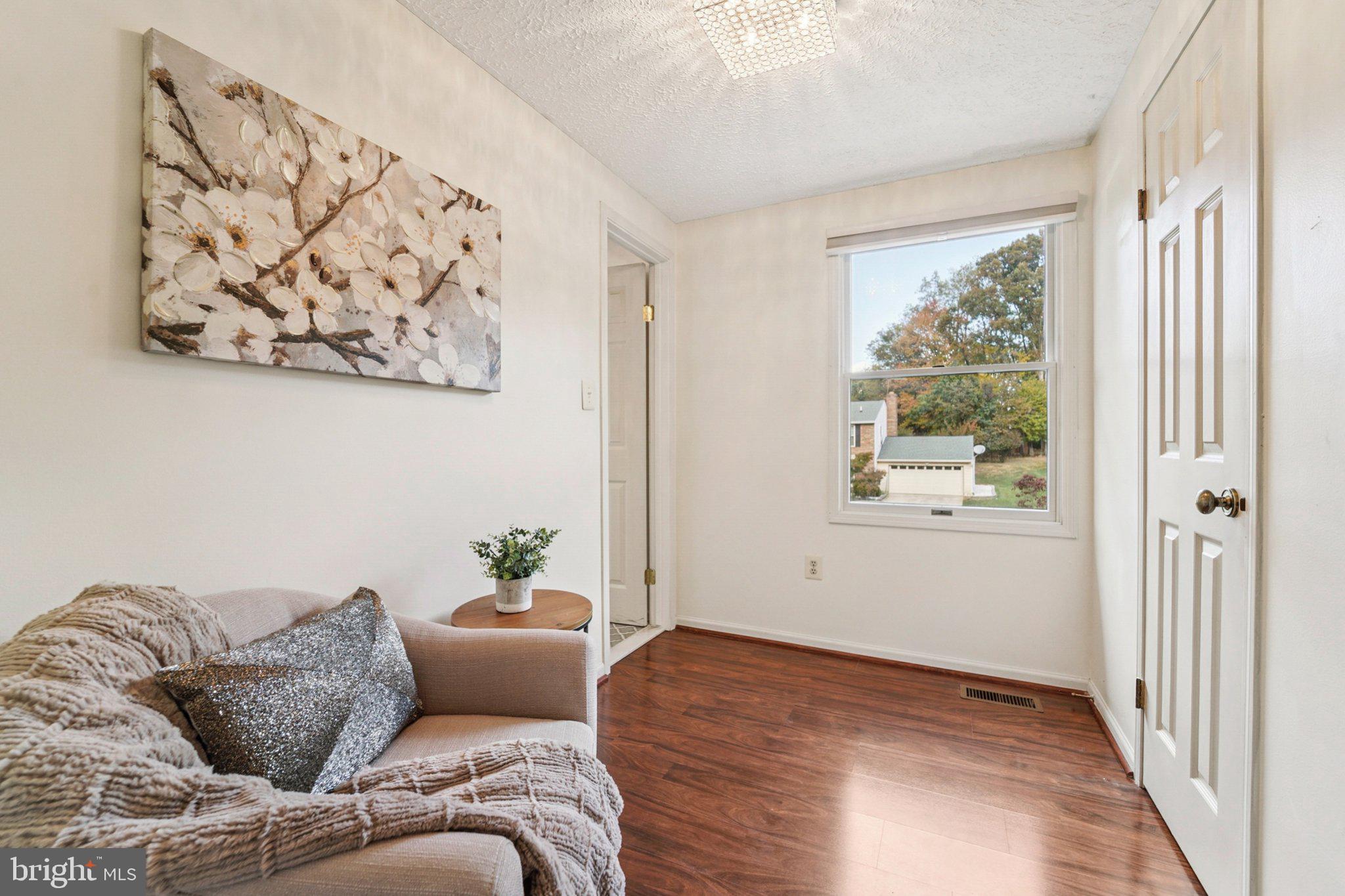 14820 Windmill Terrace Silver Spring, MD 20905 - Photo 20 of 33 a living room with furniture and a window