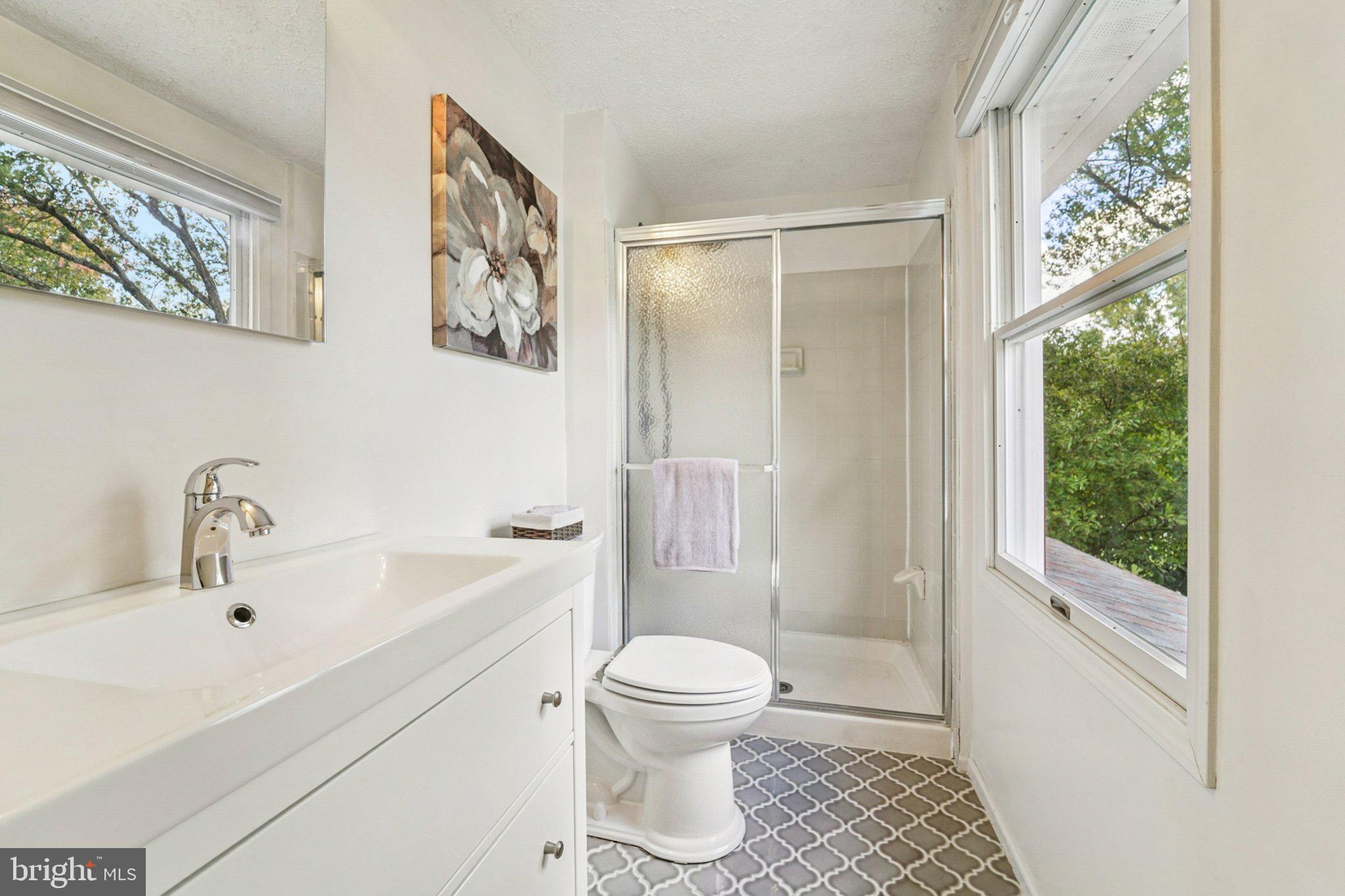 14820 Windmill Terrace Silver Spring, MD 20905 - Photo 21 of 33 a bathroom with a sink toilet and shower