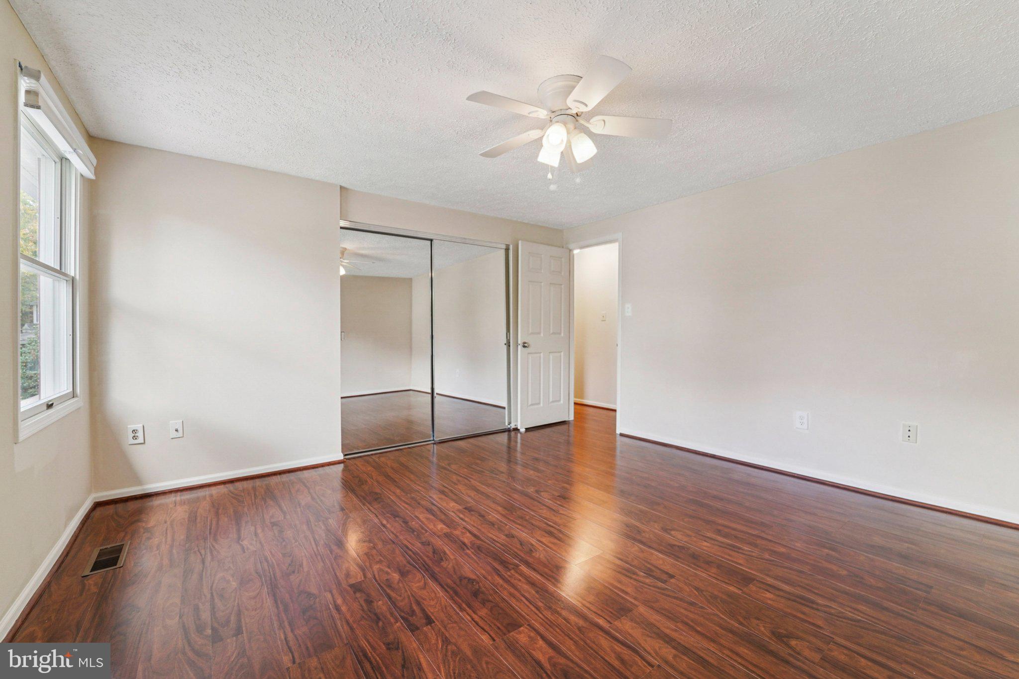 14820 Windmill Terrace Silver Spring, MD 20905 - Photo 23 of 33 wooden floor in an empty room with a window