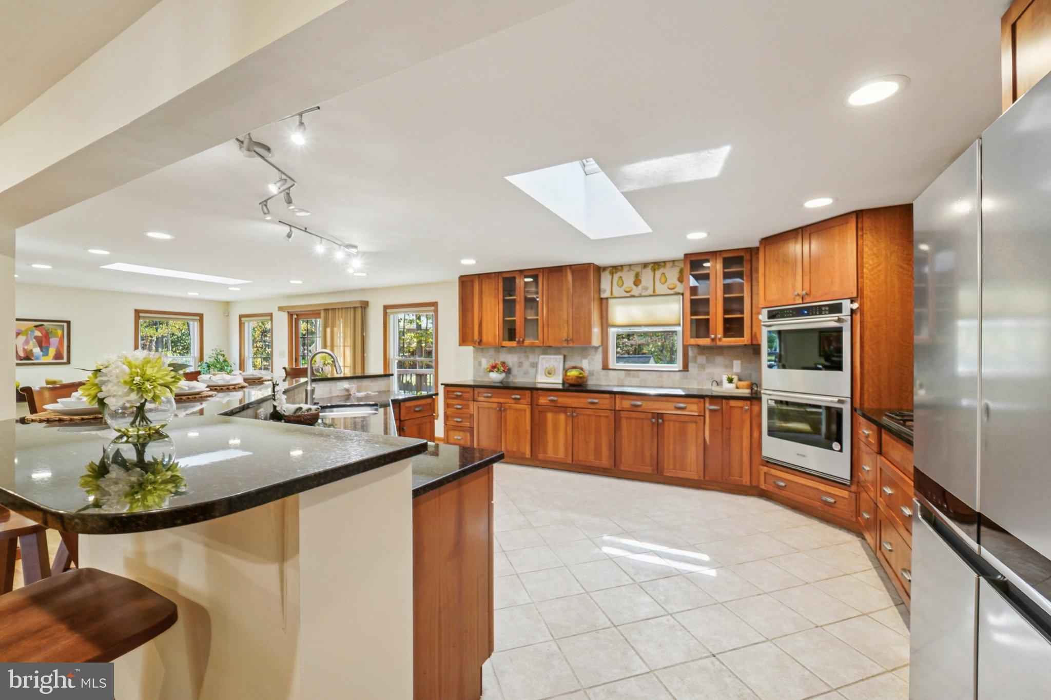 14820 Windmill Terrace Silver Spring, MD 20905 - Photo 6 of 33 a kitchen with stainless steel appliances granite countertop a sink and cabinets