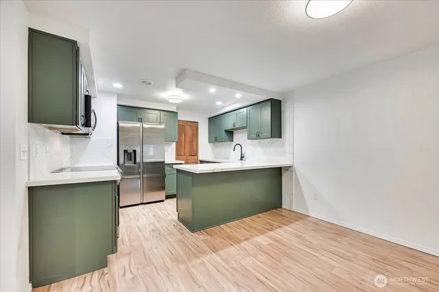 a bedroom with a bed and a television