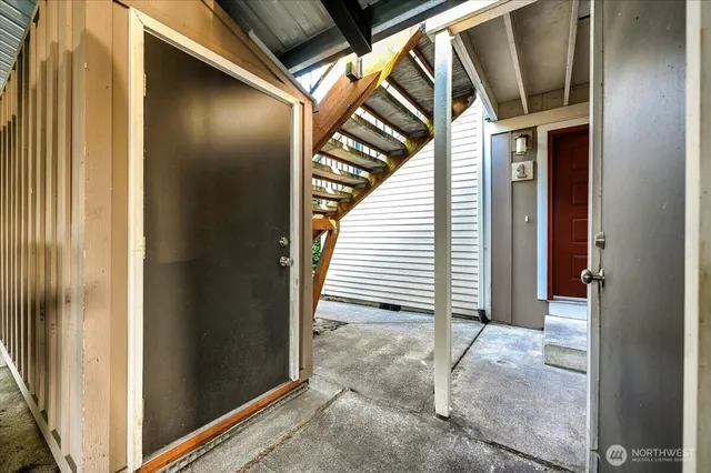 an aerial view of a house with a yard and balcony