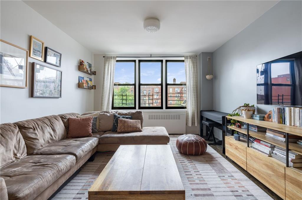 a living room with furniture and a window