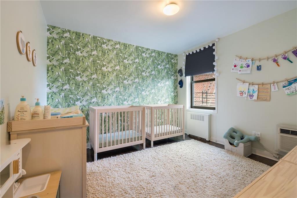 515 East 7th Street, Unit 5H Brooklyn, NY 11218 - Photo 12 of 17 a bedroom with furniture and a window