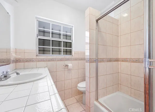 a bathroom with a sink and a shower