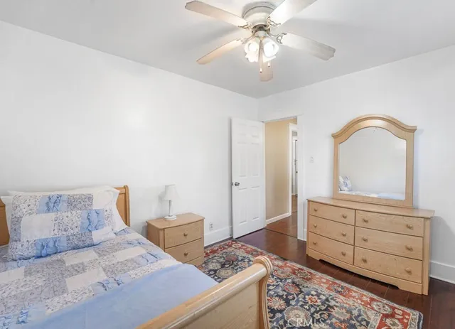 a bedroom with a bed and a dresser