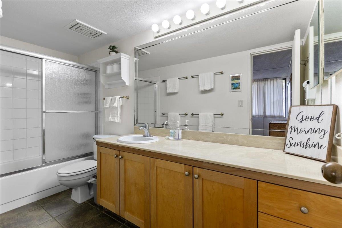 2695 South Kihei Road, Unit 4301 Kihei, HI 96753 - Photo 17 of 45 a spacious bathroom with a granite countertop sink a toilet a mirror and shower
