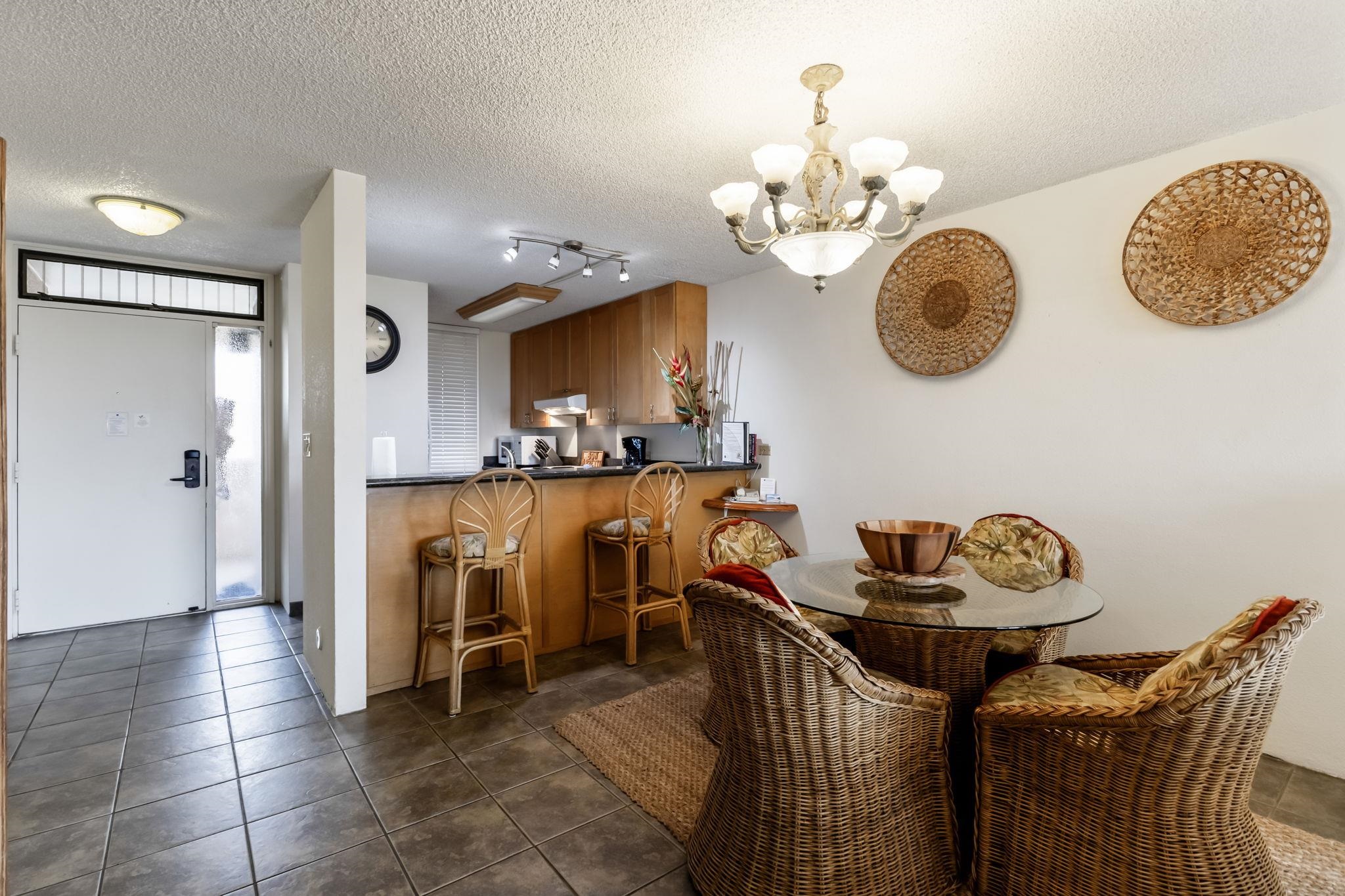 2695 South Kihei Road, Unit 4301 Kihei, HI 96753 - Photo 18 of 45 a view of a dining area with furniture