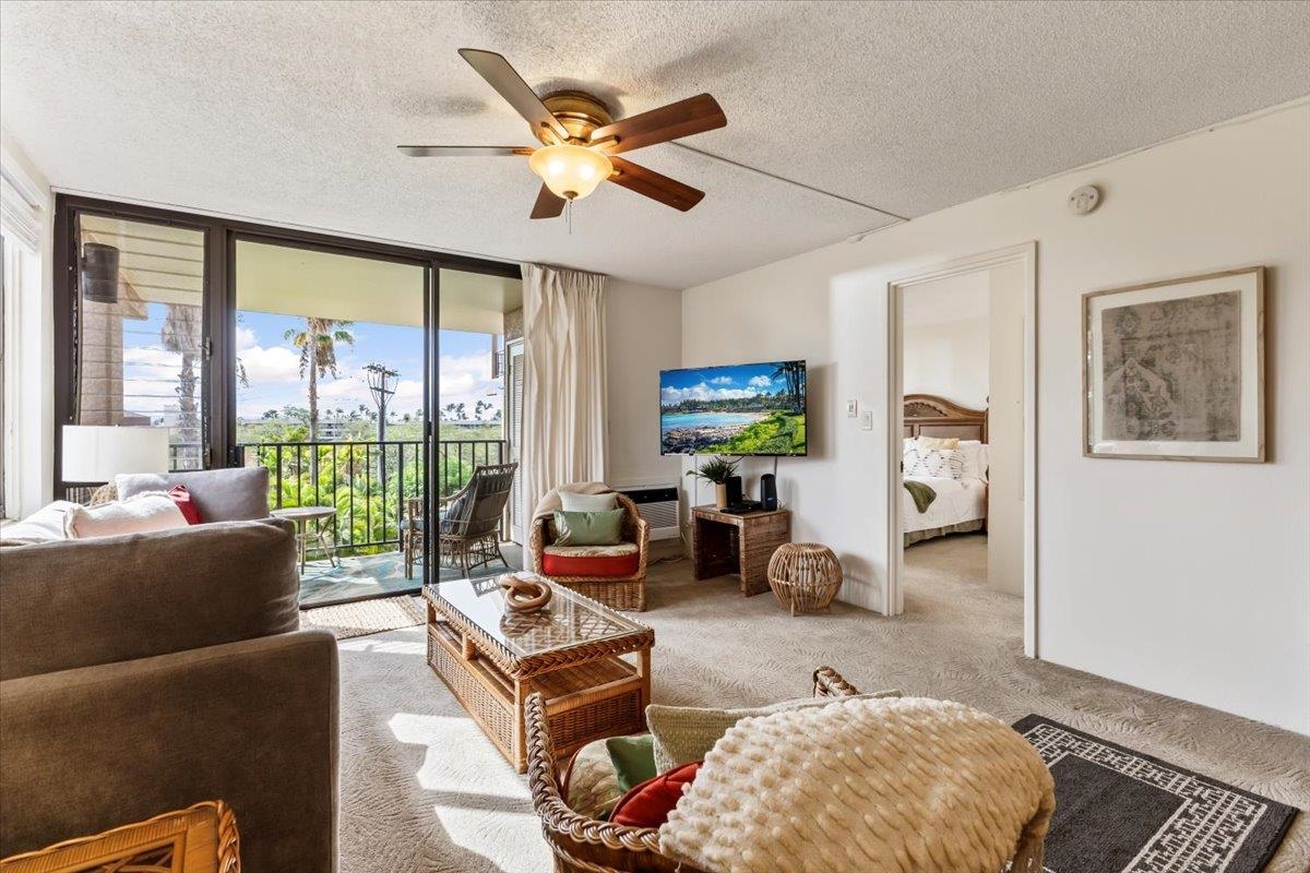 2695 South Kihei Road, Unit 4301 Kihei, HI 96753 - Photo 21 of 45 a living room with furniture and a flat screen tv
