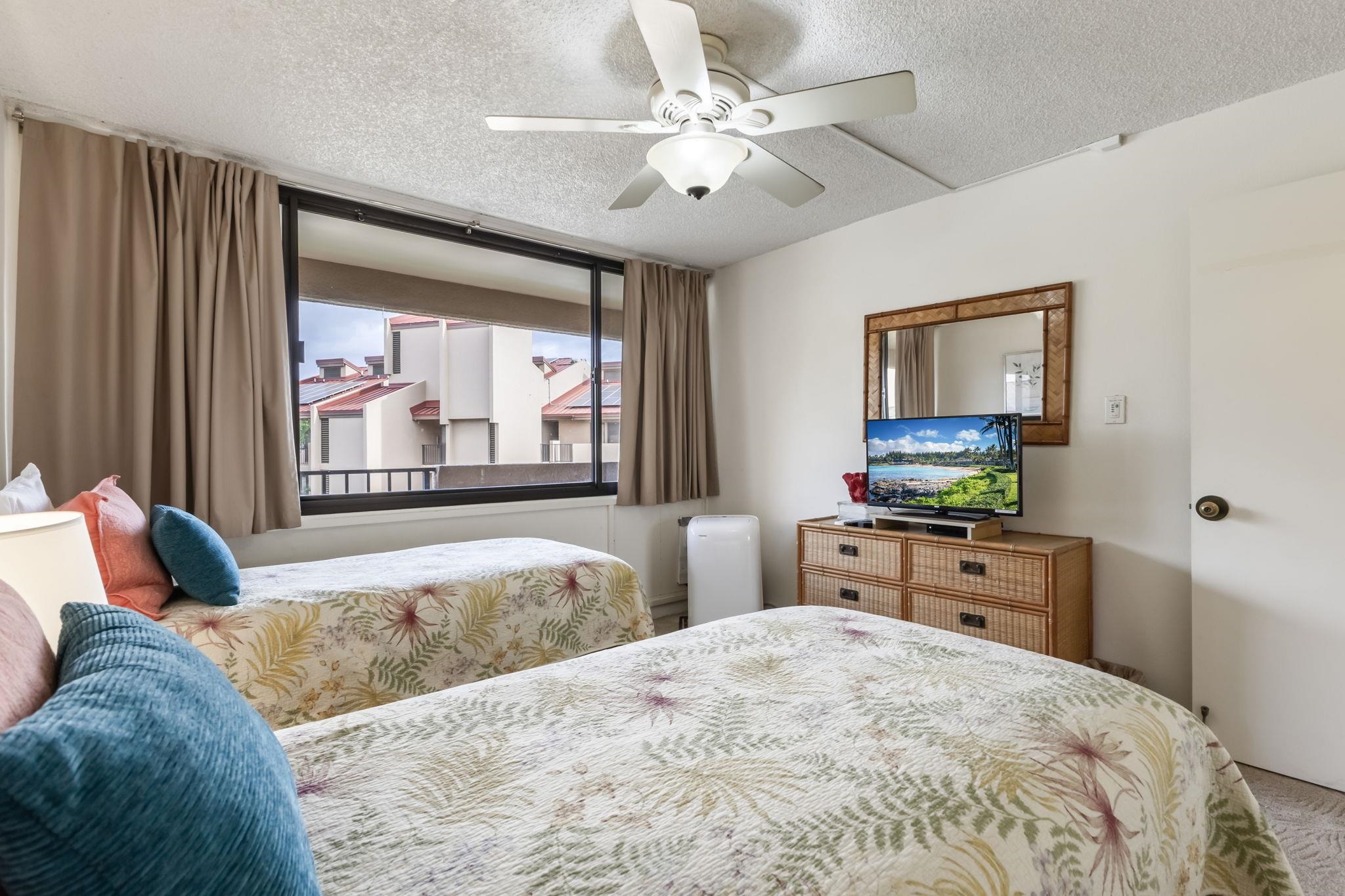 2695 South Kihei Road, Unit 4301 Kihei, HI 96753 - Photo 23 of 45 a bedroom with a large bed and a large window