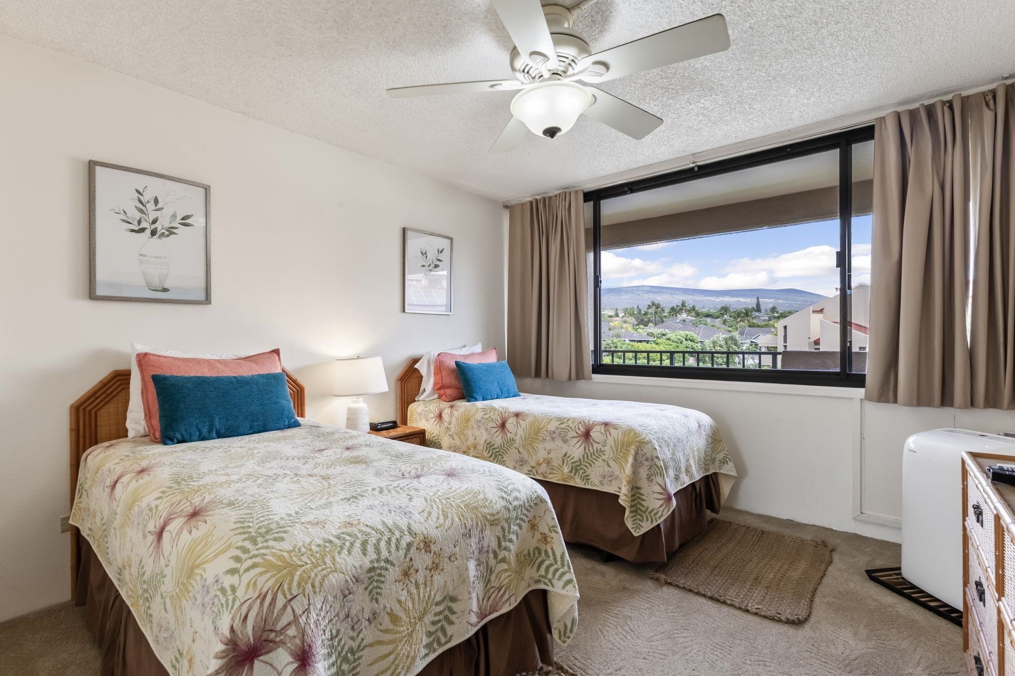 2695 South Kihei Road, Unit 4301 Kihei, HI 96753 - Photo 24 of 45 a bed room with two beds and a large window