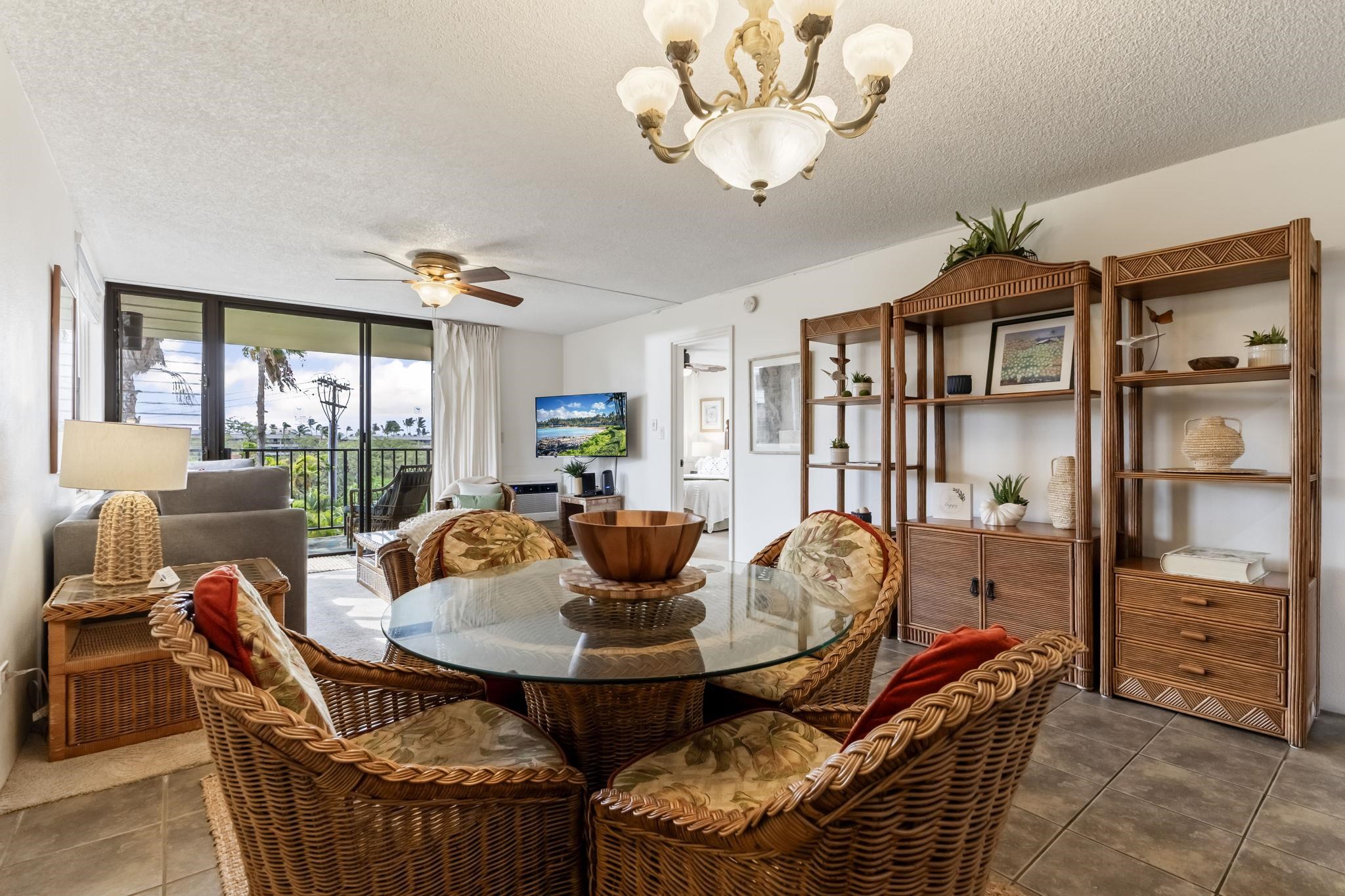 2695 South Kihei Road, Unit 4301 Kihei, HI 96753 - Photo 6 of 45 a dining room with furniture a livingroom view and wooden floor