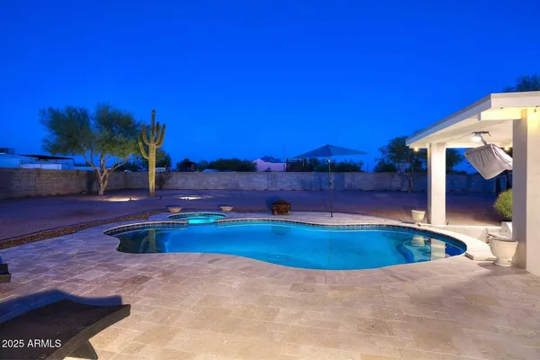 a view of swimming pool with outdoor seating
