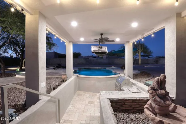 a view of a hallway with entryway wooden floor and front door