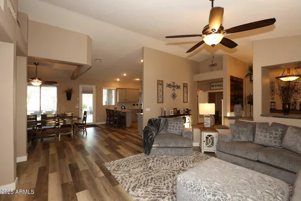 a kitchen with lots of counter space a sink appliances and cabinets