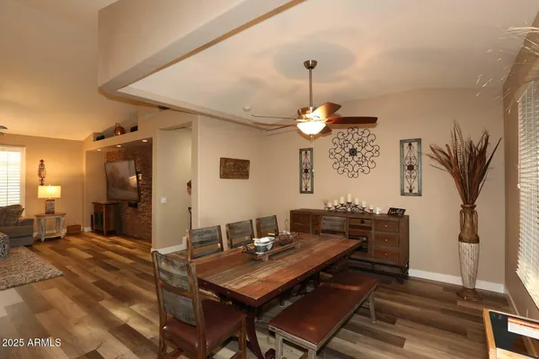 a kitchen with stainless steel appliances a stove a sink and cabinets