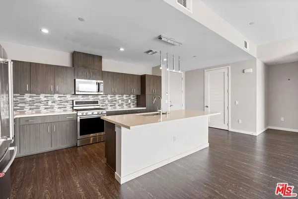 a view of kitchen with wooden floor