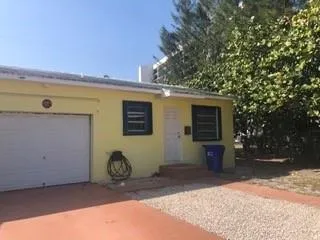 a house with trees in front of it