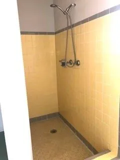 a white toilet sitting next to a white sink