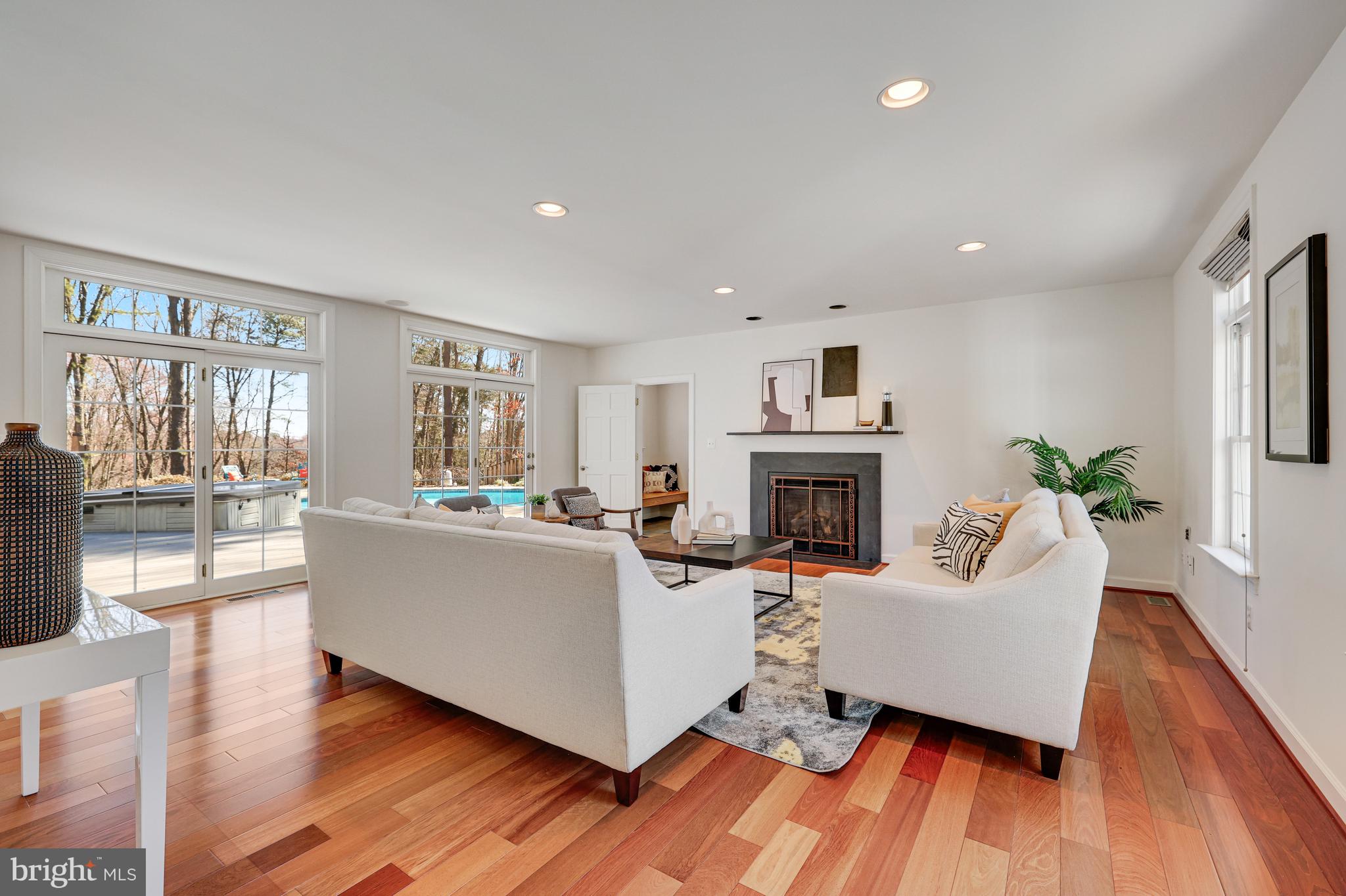 1807 Post Oak Trail Reston, VA 20191 - Photo 10 of 79 a living room with furniture and a fireplace