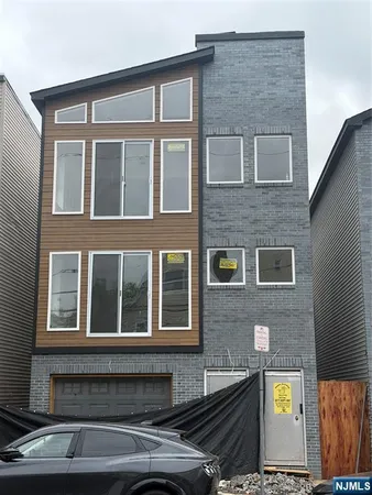 a front view of residential houses with street