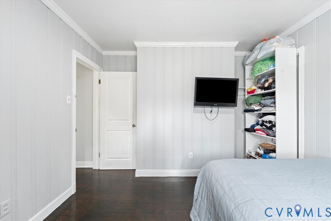 3930 Patsy Ann Drive Richmond, VA 23234 - Photo 21 of 36 Bedroom featuring dark wood-type flooring, crown m