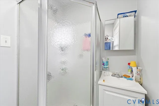 a bathroom with a sink toilet and window