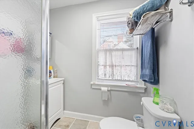 a big house with large trees in front of it