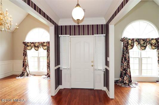 105 Wilton Circle Perry, GA 31069 - Photo 2 of 35 wooden floor in an empty room with a window