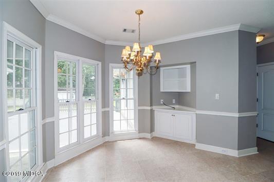 105 Wilton Circle Perry, GA 31069 - Photo 13 of 35 a room with chandelier and entryway