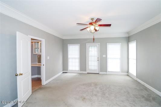 105 Wilton Circle Perry, GA 31069 - Photo 16 of 35 a view of a livingroom with a ceiling fan and window