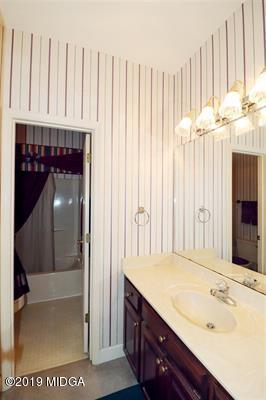 105 Wilton Circle Perry, GA 31069 - Photo 21 of 35 a bathroom with a sink and a mirror