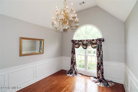 105 Wilton Circle Perry, GA 31069 - Photo 4 of 35 a view of a room with wooden floor potted plant and a chandelier