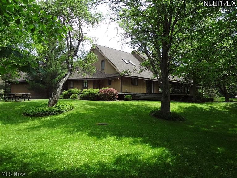 7680 Valley View Road Hudson, OH 44236 - Photo 3 of 25 View of the rear of the home. The deck wraps around part of the home. There are picnic areas and a small frog pond, an arbor and a swing all for quiet enjoyment or fun picnics.