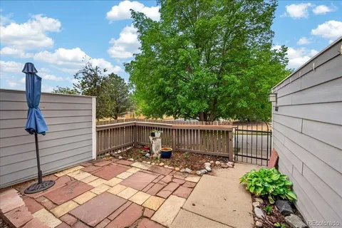 a view of a wooden deck with furniture