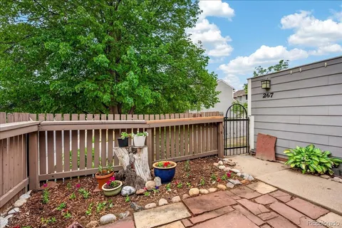 a front view of a house with wooden fence