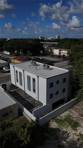 an aerial view of a house with outdoor space