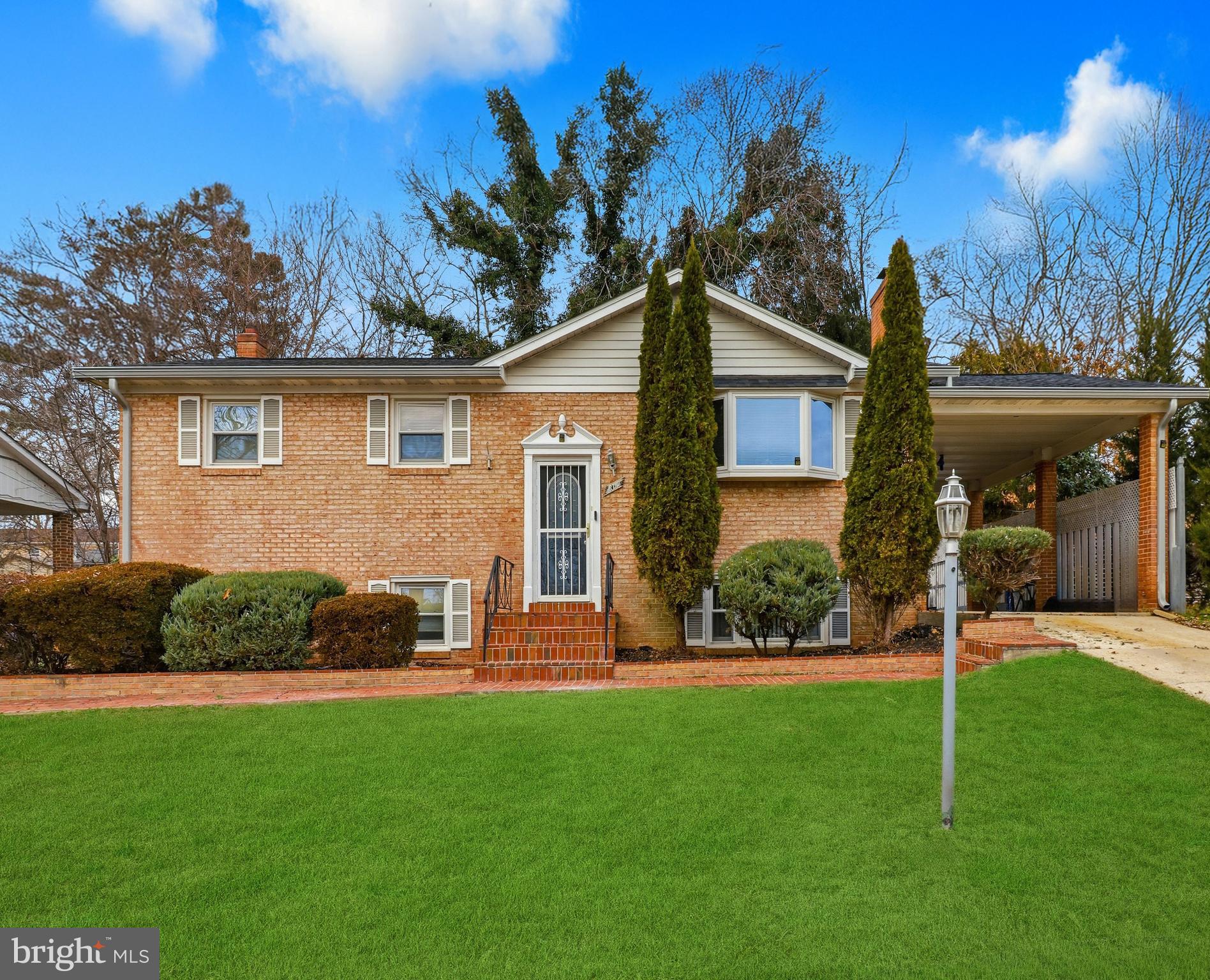 6710 Eilerson Street Clinton, MD 20735 - Photo 1 of 58 a front view of a house with a yard and green space